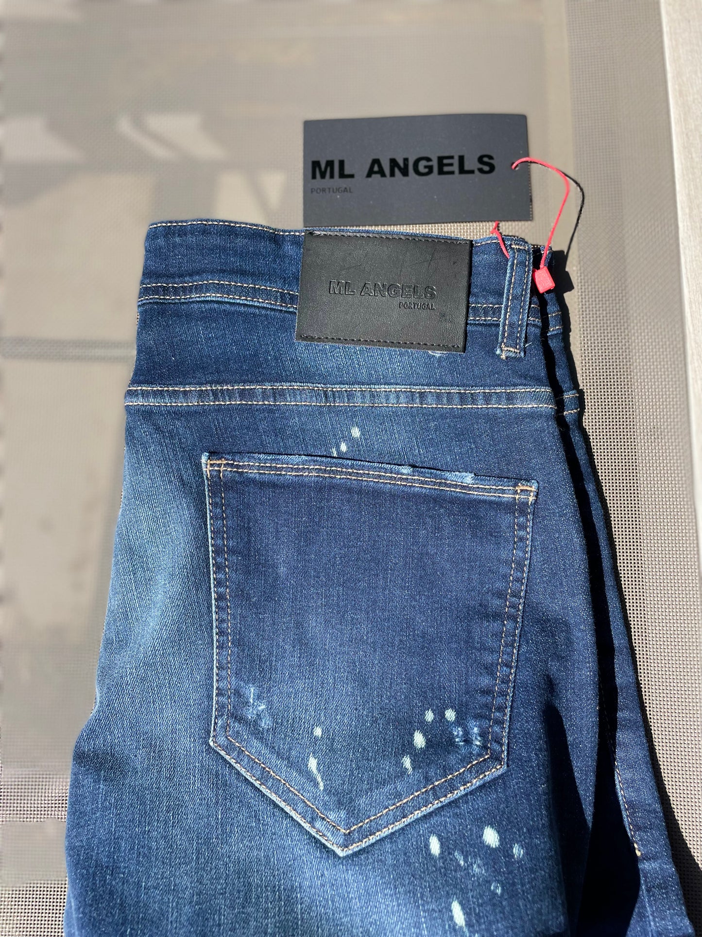 Le cannes jeans bleu tacheté pour homme coupe regular